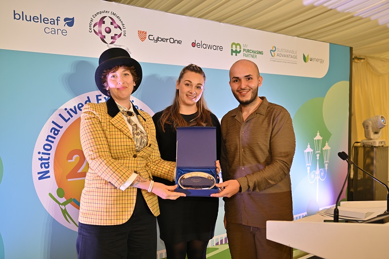 Head Judge Em Greyharbour, and Freya Luckitt from Sustainable Advantage, the Community & Collaboration award sponsor, accepting the award on behalf of The Borrow & Buy. 