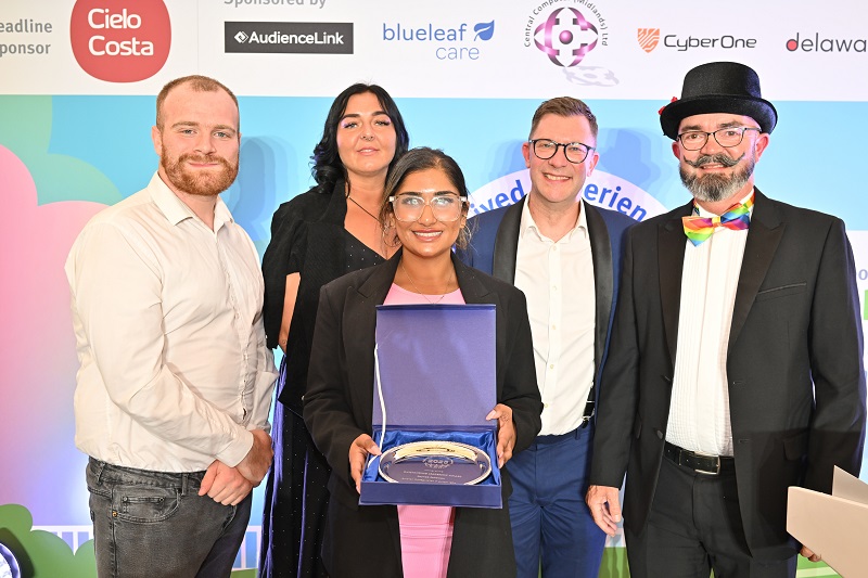 Zaynab receiving her Outstanding Leadership Award from Head Judge Ian Callaghan, award sponsor Lee Walker from Cyber One Security, along side Lived Experience Judges Johnathan and Charna. 