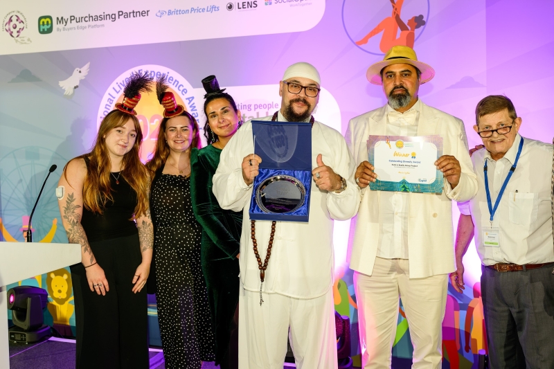Zaynab receiving her Outstanding Leadership Award from Head Judge Ian Callaghan, award sponsor Lee Walker from Cyber One Security, along side Lived Experience Judges Johnathan and Charna.